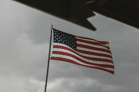 American flag exposed to rain and moisture on a flagpole