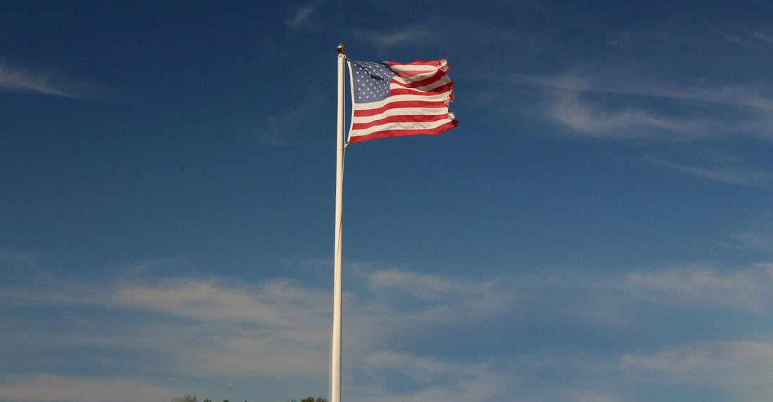 american flagpole with proper height installed at a residential home
